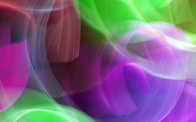 Abstract light trails suggesting fluid motion.