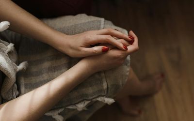 Close-up of a person's hands in a relaxed position.